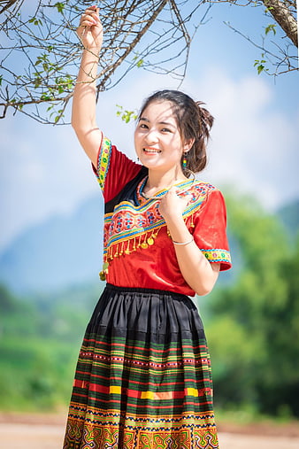 Smiling Woman in Traditional Ethnic Clothing Outdoors