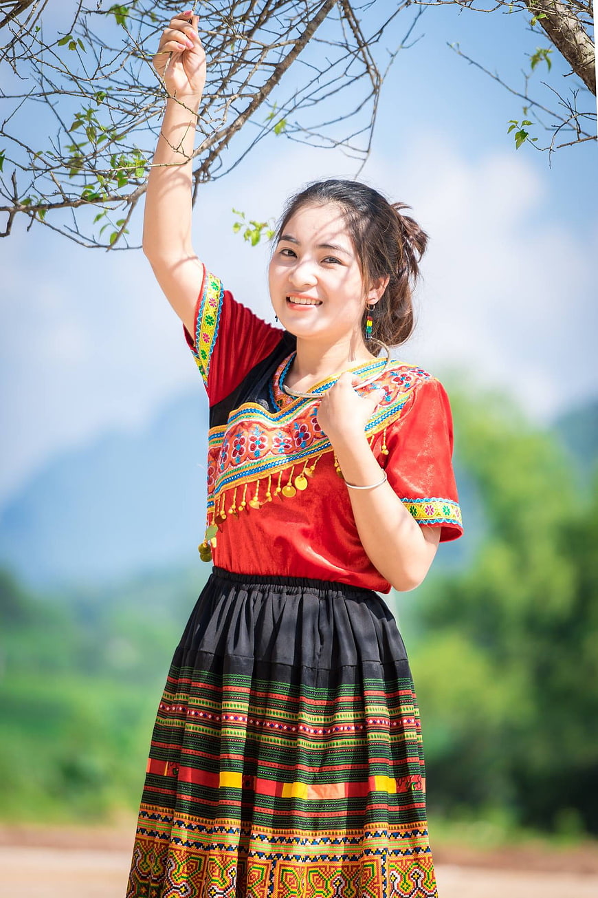 Smiling Woman in Traditional Ethnic Clothing Outdoors