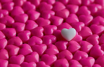 White Heart Candy Among Pink Hearts Background
