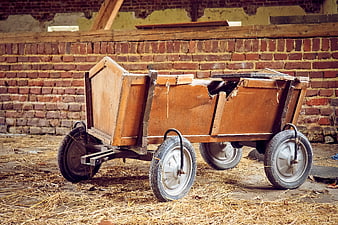 Vintage wooden cart with rubber tires in rustic barn