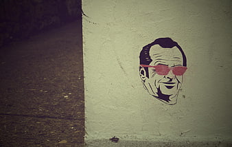 Stylized Jack Nicholson Graffiti Art On Textured Concrete Wall