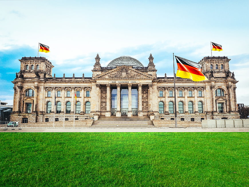 Reichstag Building Berlin Germany with German Flags
