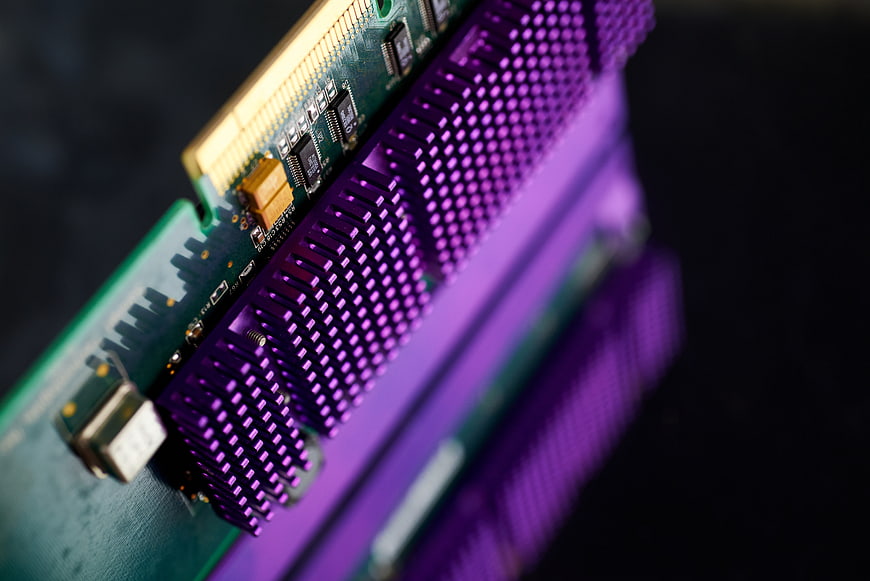 Close-up of purple computer RAM module with heat sink