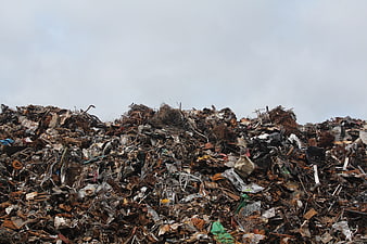 Large pile of scrap metal and industrial waste in a junkyard