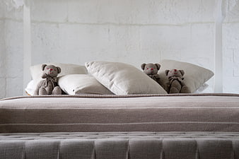 Cozy Bedroom Bed With Teddy Bears And White Brick Wall