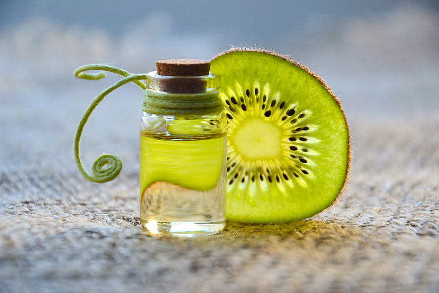 Kiwi Essential Oil in Glass Bottle on Burlap