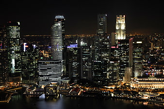 Singapore City Skyline at Night with Illuminated Skyscrapers