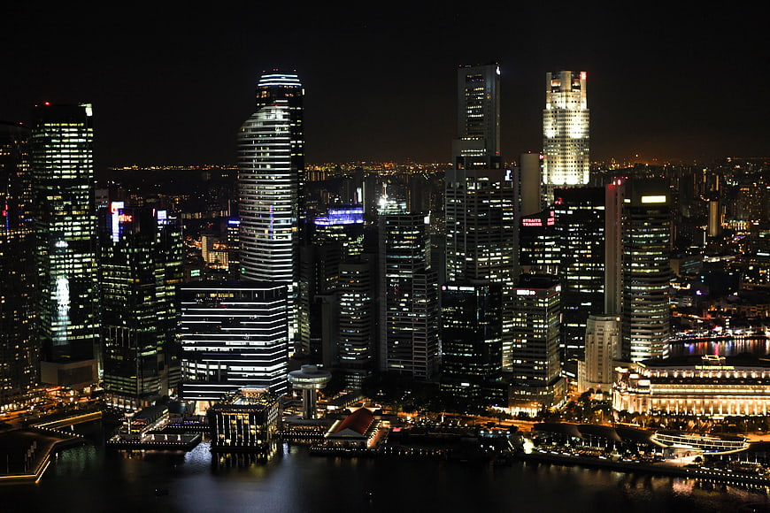 Singapore City Skyline at Night with Illuminated Skyscrapers