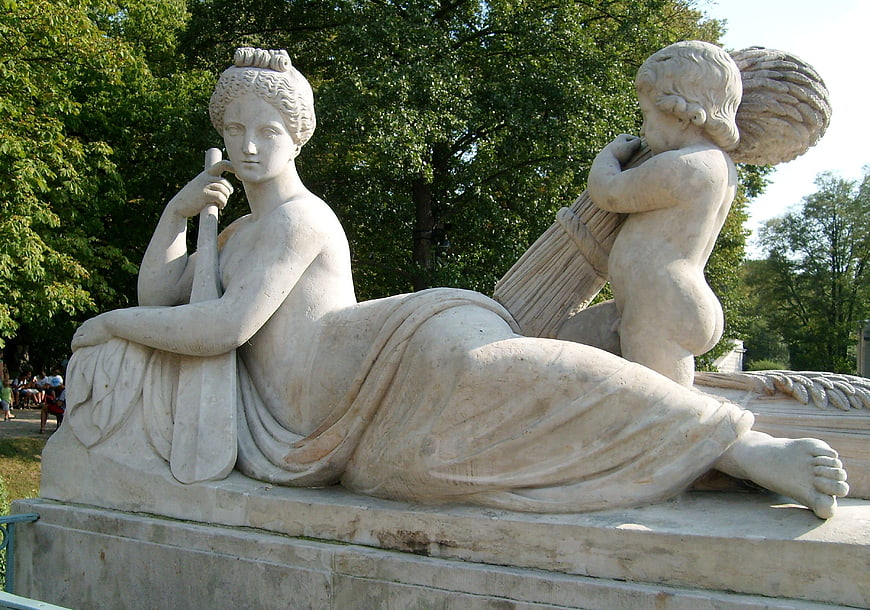 Classical Marble Sculpture of Woman and Child in Park