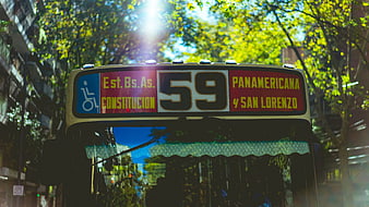 Front view of city bus number 59 with route sign
