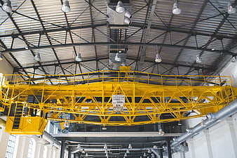 Yellow overhead crane in industrial factory warehouse