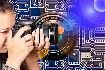 Woman Photographer with Camera on Circuit Board Background