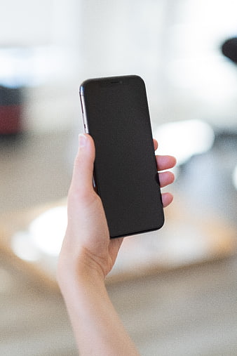 Hand Holding Black Smartphone with Blank Screen