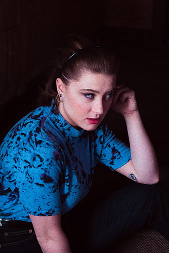Moody Portrait of Woman in Blue Patterned Top