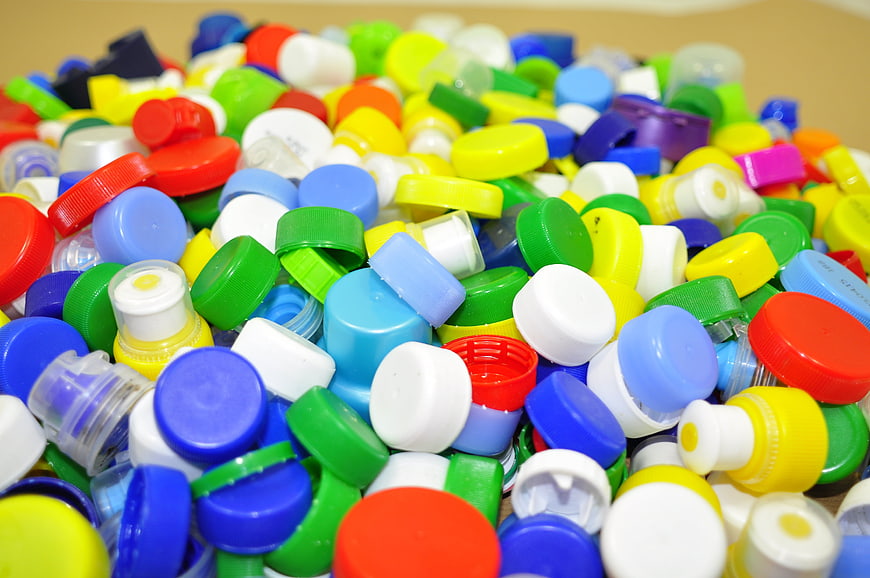 Colorful Plastic Bottle Caps Pile Recycling Concept