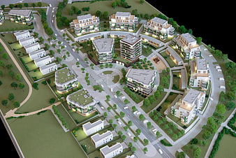Architectural model of modern residential complex with green spaces