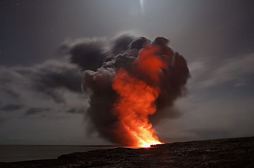 Volcanic Eruption at Night with Lava and Smoke Plume