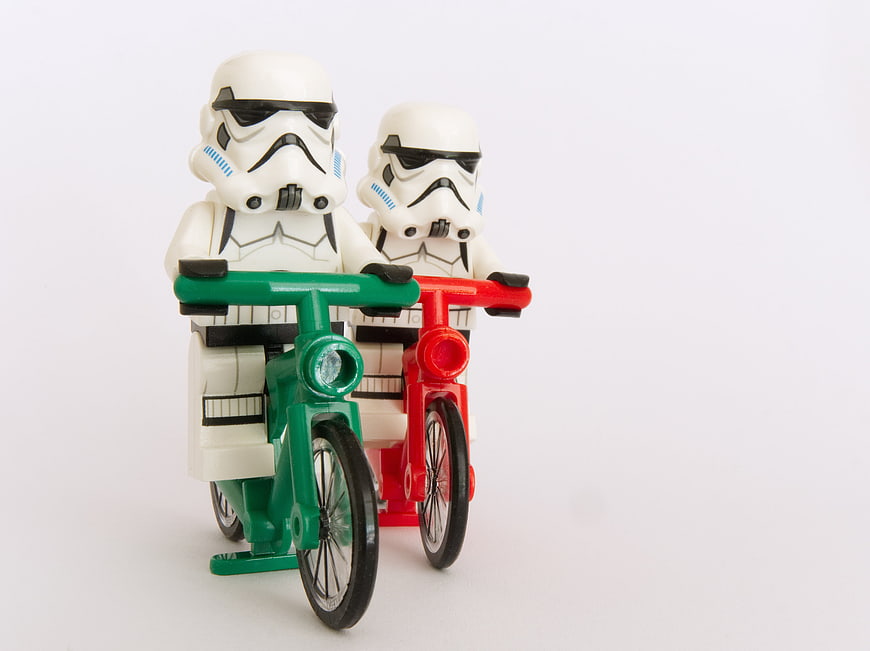 Lego Stormtroopers Riding Bicycles on White Background