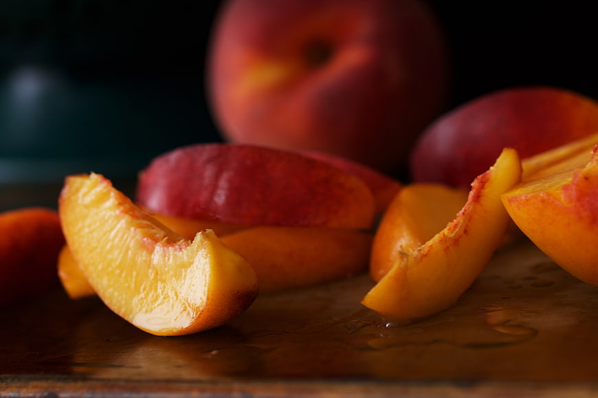 Fresh Peach Slices on Rustic Wooden Board
