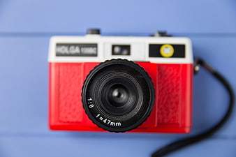 Red Holga 135BC Camera on Blue Background