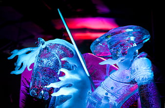 Ice sculpture of knight on horse with neon lighting