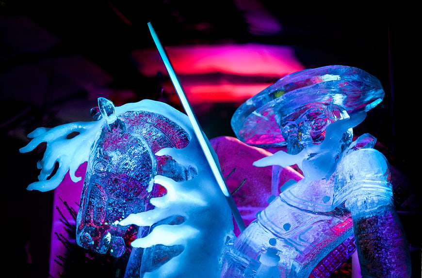 Ice sculpture of knight on horse with neon lighting