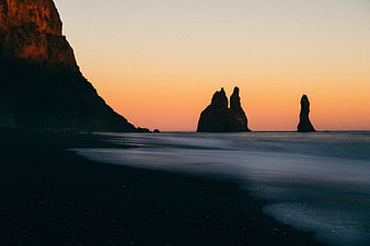 Dramatic Sunset at Reynisfjara Black Sand Beach with Sea Stacks