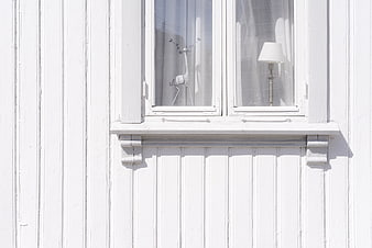 Minimalist White Wooden House Exterior with Window