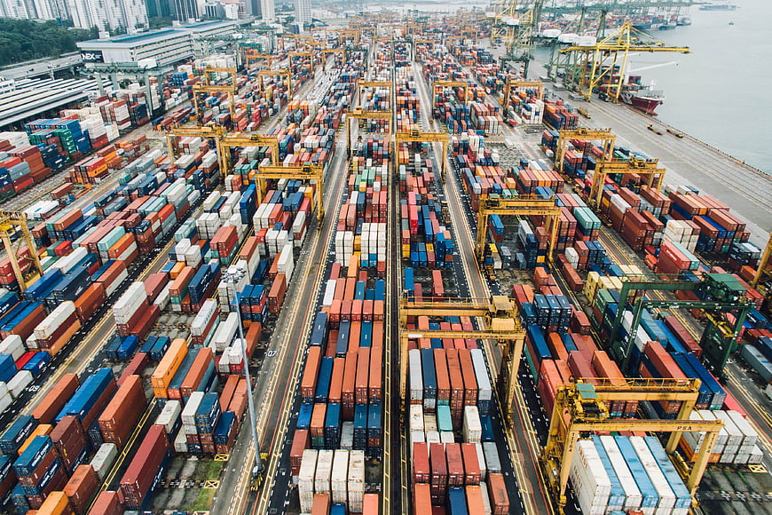 Aerial View of Busy Container Port with Shipping Cranes
