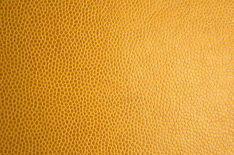 Yellow textured leather surface background