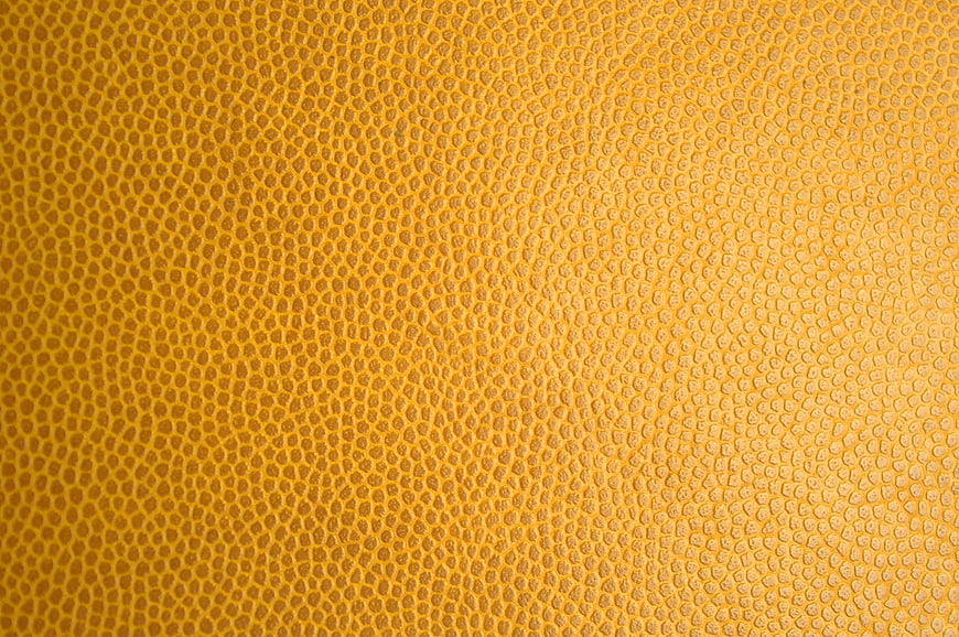 Yellow textured leather surface background