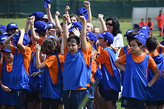 Excited Youth Soccer Team Celebrating Victory On Field