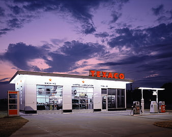 Vintage Texaco Gas Station At Dusk With Dramatic Purple Sky