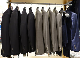 Men's Suit Jackets Hanging on Rack in Department Store