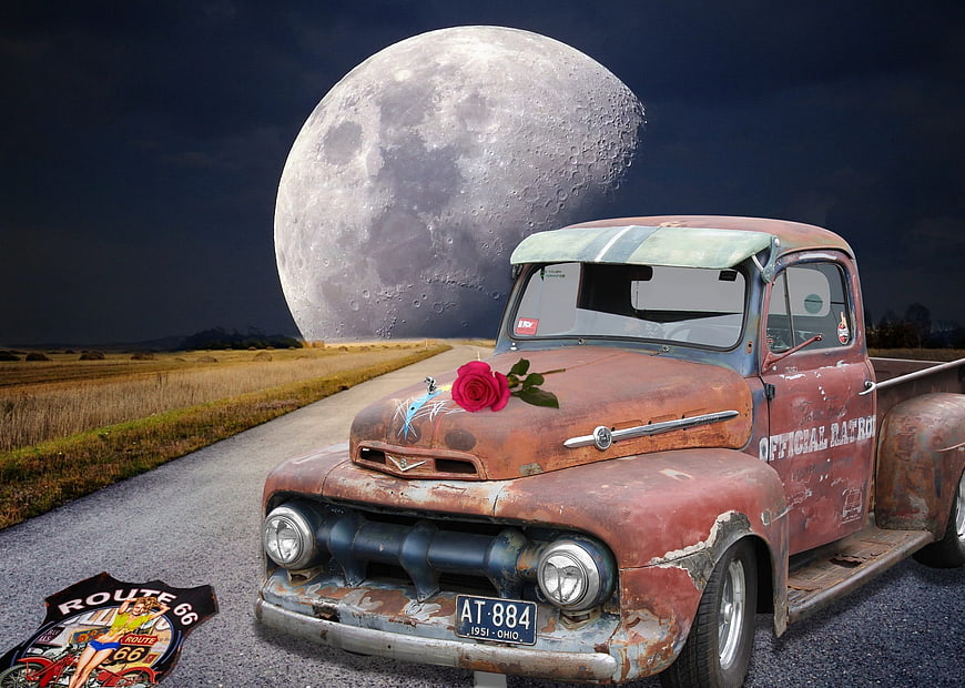 Rusted Vintage Ford Truck with Red Rose and Route 66 Sign Under Giant Moon