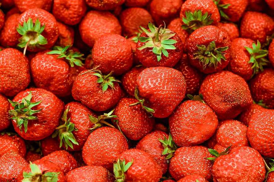 Close-up of fresh red strawberries filling the frame