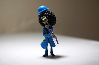 Brook Skeleton Figurine Wearing Blue Coat and Bowler Hat