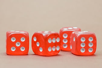 Four Red Dice On Beige Background