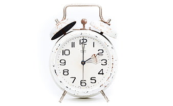 Vintage White Rusty Alarm Clock on White Background