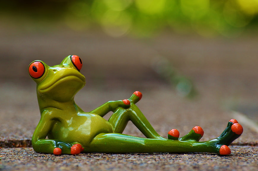Relaxed Green Frog Figurine with Red Eyes