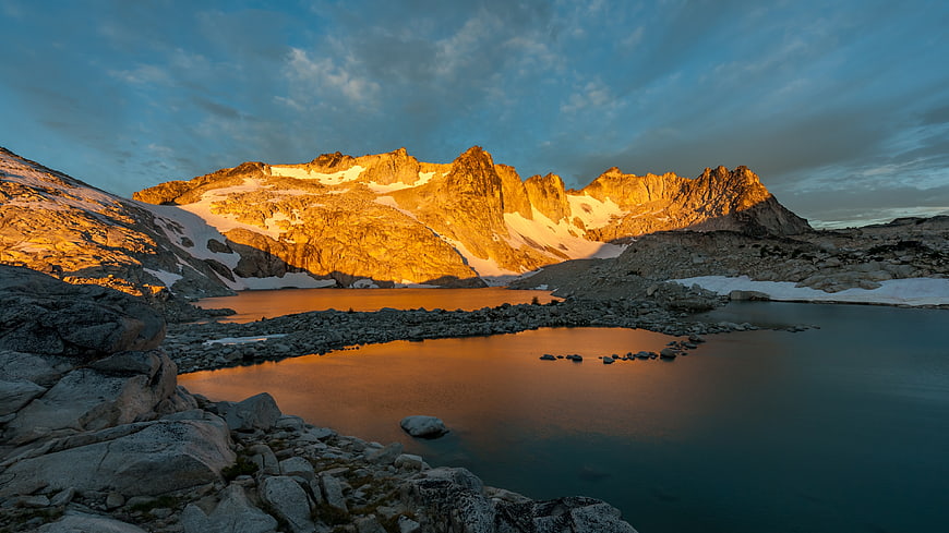 Alpine Lake at Sunset with Golden Mountain Peaks