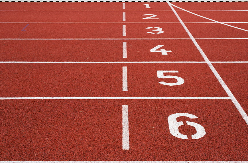 Red Running Track Lanes With White Numbers 1 To 6