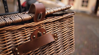Close-up of Woven Wicker Basket with Leather Straps