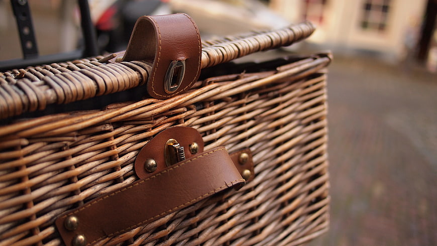 Close-up of Woven Wicker Basket with Leather Straps