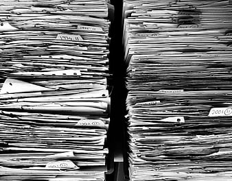 Black and white stacks of archived paper files