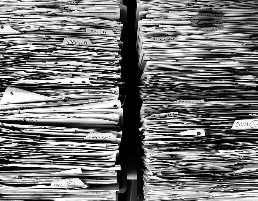 Black and white stacks of archived paper files