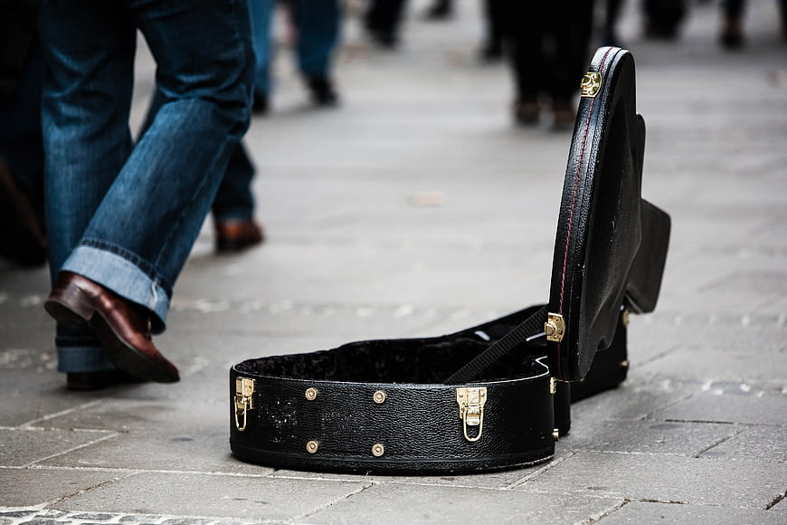 Open Black Guitar Case on Street for Busking