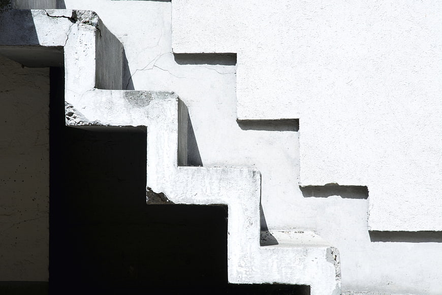 Abstract White Concrete Staircase Architecture With High Contrast Shadows