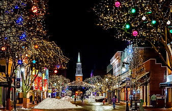 Christmas Lights on Downtown Street with Church Spire at Night