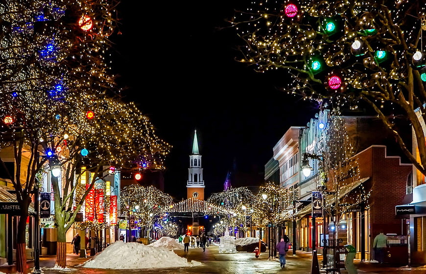Christmas Lights on Downtown Street with Church Spire at Night